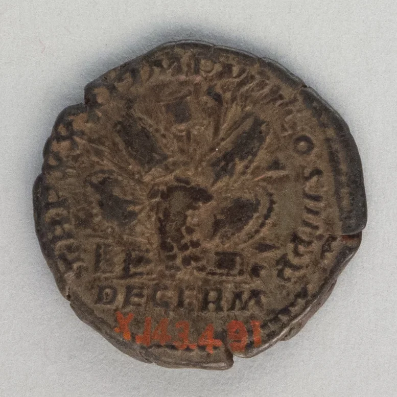 Reverse of a Roman silver denarius of Marcus Aurelius showing a trophy of captured arms over the words DE GERM